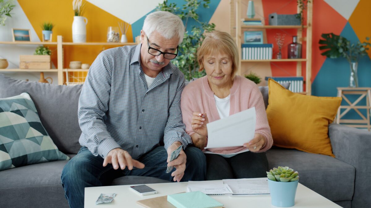 Older person reviewing a calendar with payment dates